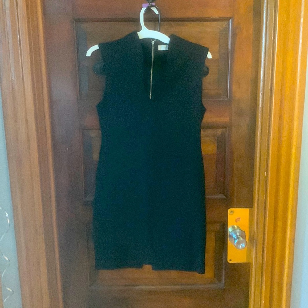 Was my LBD. Slimming body con black dress. Hits right above the knee.